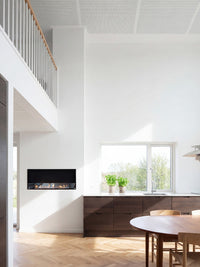 Side view of Decoflame Montreal 1200mm bioethanol fireplace showcasing the sleek glass panel and real dancing flames.