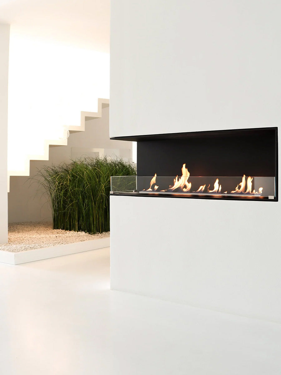 Side view of Decoflame Montreal 1200mm left corner bioethanol fireplace with sleek glass panel and modern design.