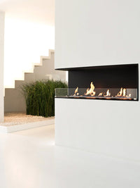 Side view of Decoflame Montreal 1200mm left corner bioethanol fireplace with sleek glass panel and modern design.