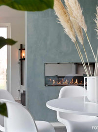 Side view of Decoflame Montreal 1200mm tunnel bioethanol fireplace with sleek glass panels and modern design.