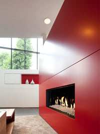 Side view of Kalfire G100/41F gas fire showcasing the sleek glass front and realistic flames in a modern living room setting.