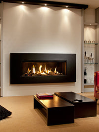 Side view of Kalfire G120/41F gas fire showcasing the sleek design and vibrant flames through the large glass window.