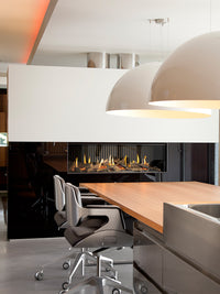 Close-up view of Kalfire G120/41F gas fire showcasing flames through a sleek black frame and large glass window.