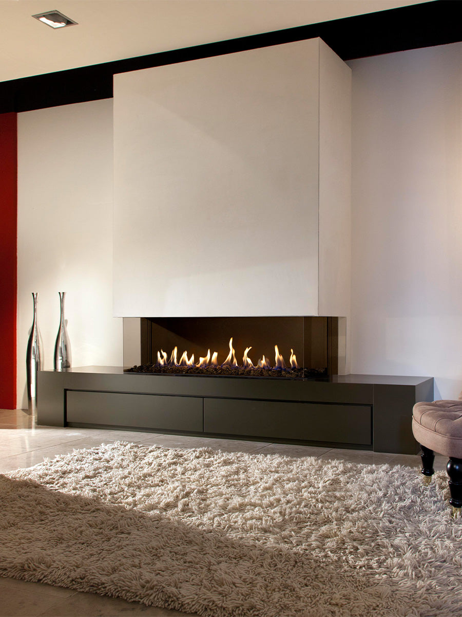 Three-sided Kalfire G130/37S gas fire with panoramic glass, showcasing flames and sleek design in a modern setting.