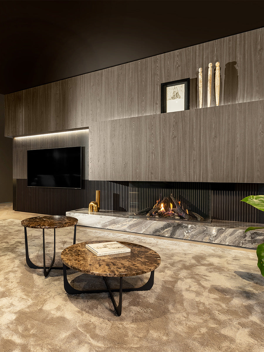 Three-sided Kalfire Gi115/55S gas fireplace with glass panels, showcasing dynamic flames in a modern living space.