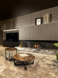 Three-sided Kalfire Gi115/55S gas fireplace with glass panels, showcasing dynamic flames in a modern living space.