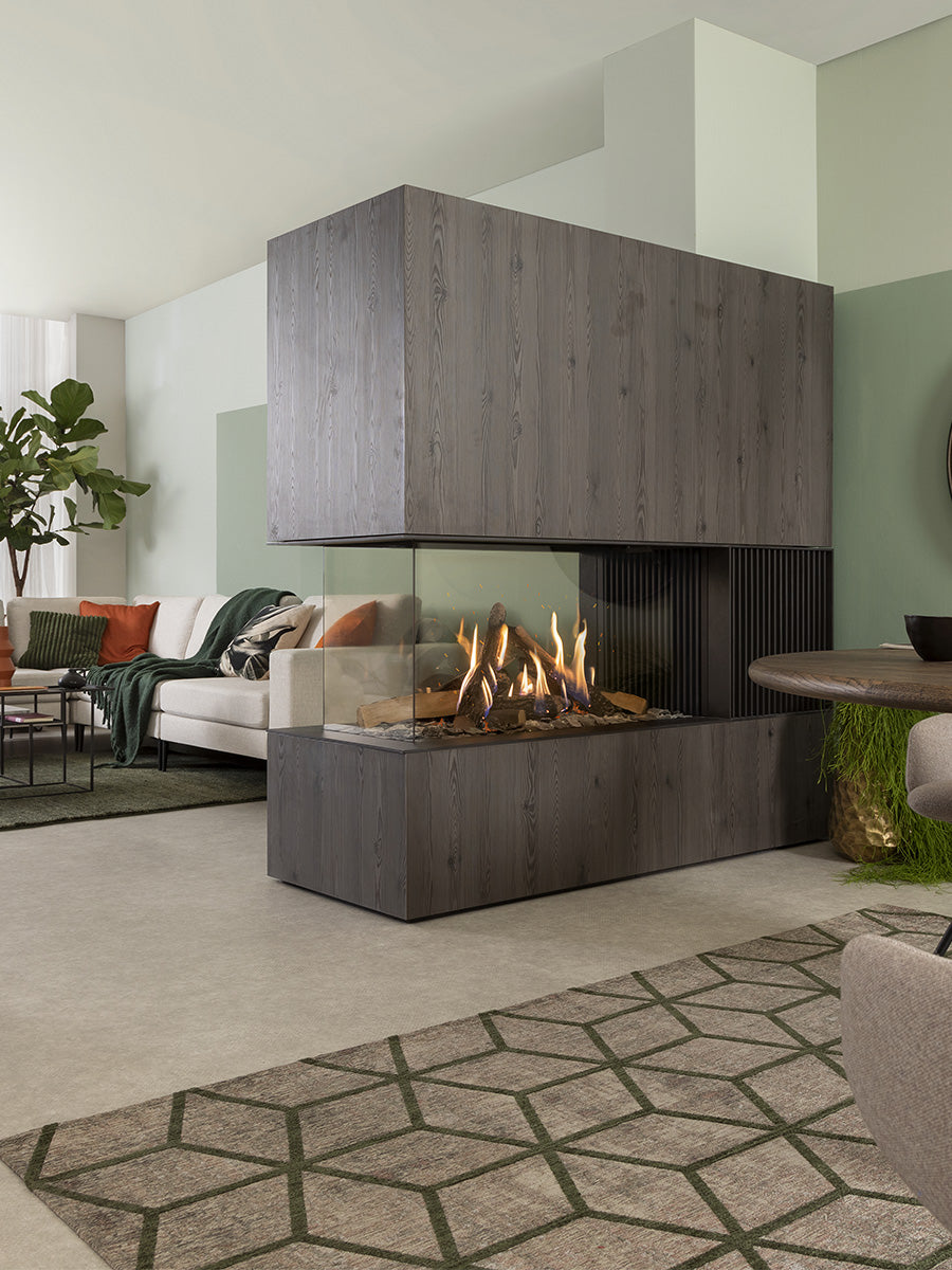 Modern Kalfire GP115/55R gas fire room divider with glass front, ceramic logs, and sleek design in a stylish living space.
