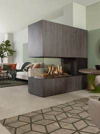 Modern Kalfire GP115/55R gas fire room divider with glass front, ceramic logs, and sleek design in a stylish living space.