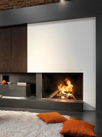 Front view of Kalfire W100/61F log burner fireplace with frameless curved glass and wood logs, showcasing flames and heat output.