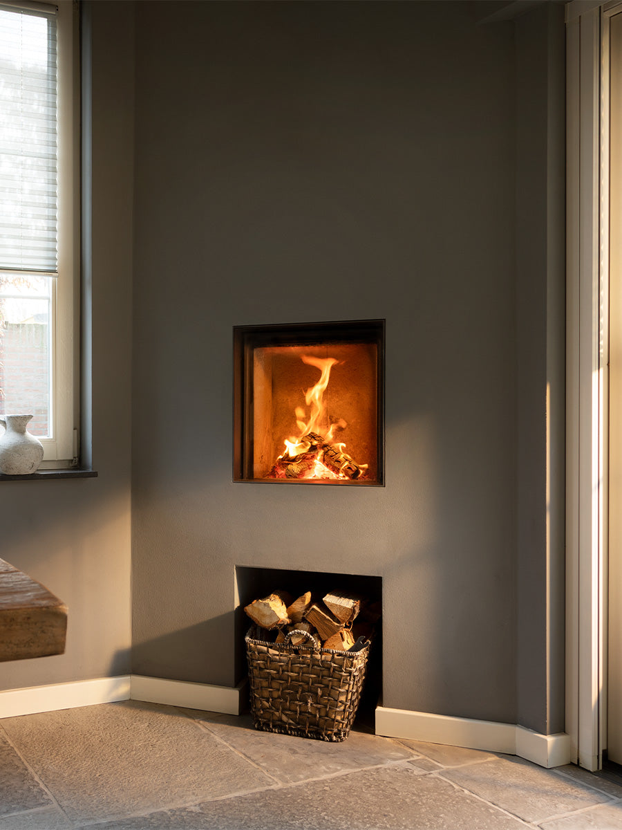 Front view of Kalfire W45/48F log burner fireplace with frameless curved glass and sleek black finish.