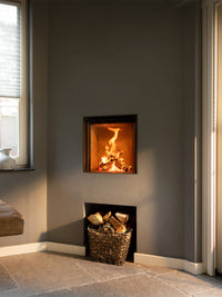 Front view of Kalfire W45/48F log burner fireplace with frameless curved glass and sleek black finish.