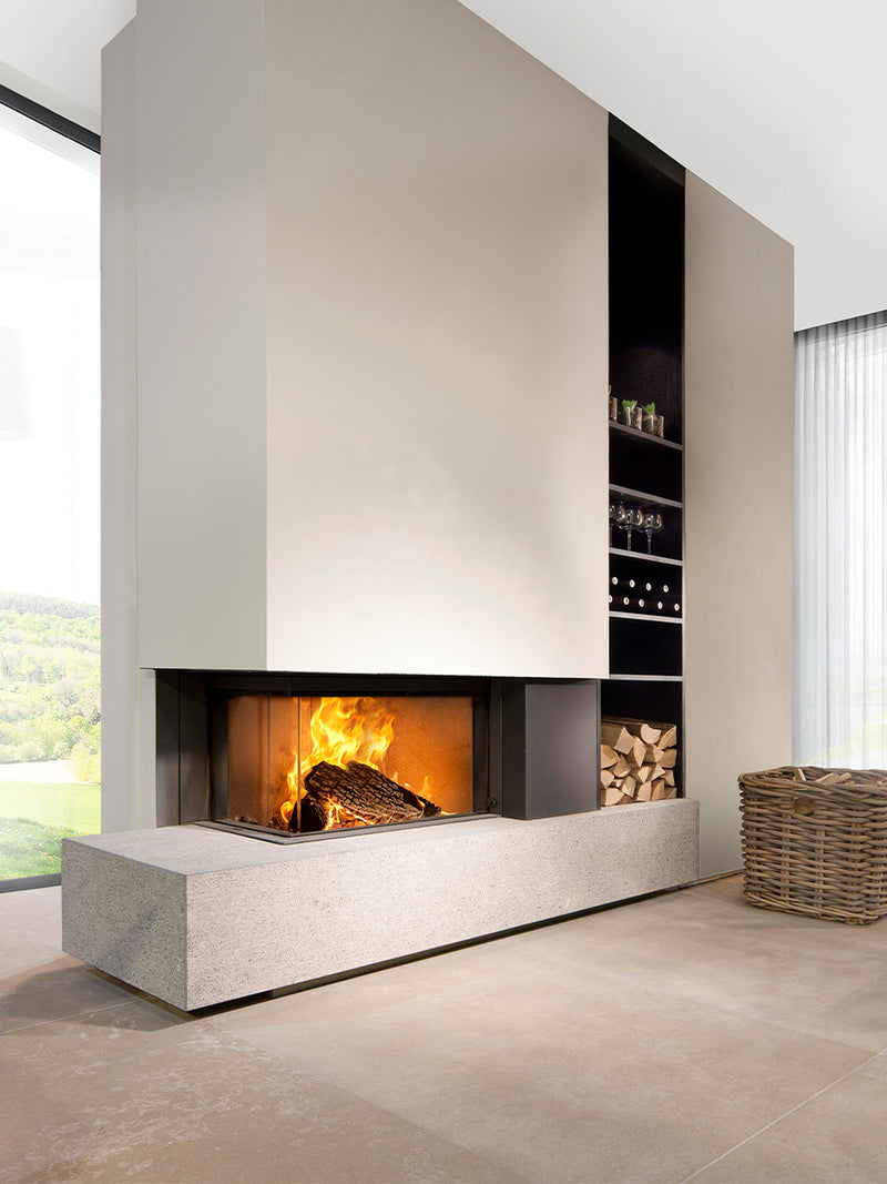 Side view of Kalfire W65/38C corner wood burner fireplace with curved glass and sleek design in a modern setting.