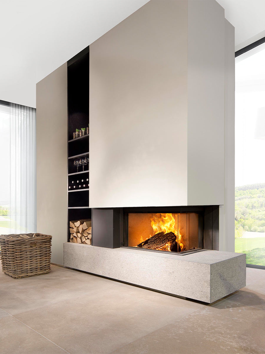 Compact corner wood burner with curved ceramic glass, showcasing sleek design and efficient heating in a stylish setting.