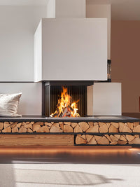 Three-sided Kalfire W66/48S log burner fireplace with curved ceramic glass, showcasing flames and modern design.