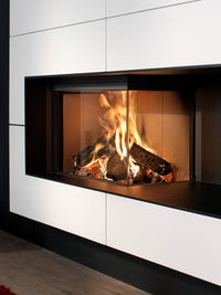 Side view of Kalfire W90/47C corner log burner with curved glass, showcasing its sleek design and ceramic finish.