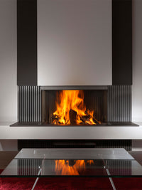 Side view of Kalfire W90/47S three-sided log burner fireplace with curved glass panels and modern design.