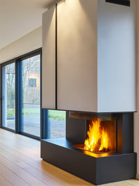 Three-sided Kalfire W90/47S log burner fireplace with curved glass, showcasing flames and sleek design in a modern setting.