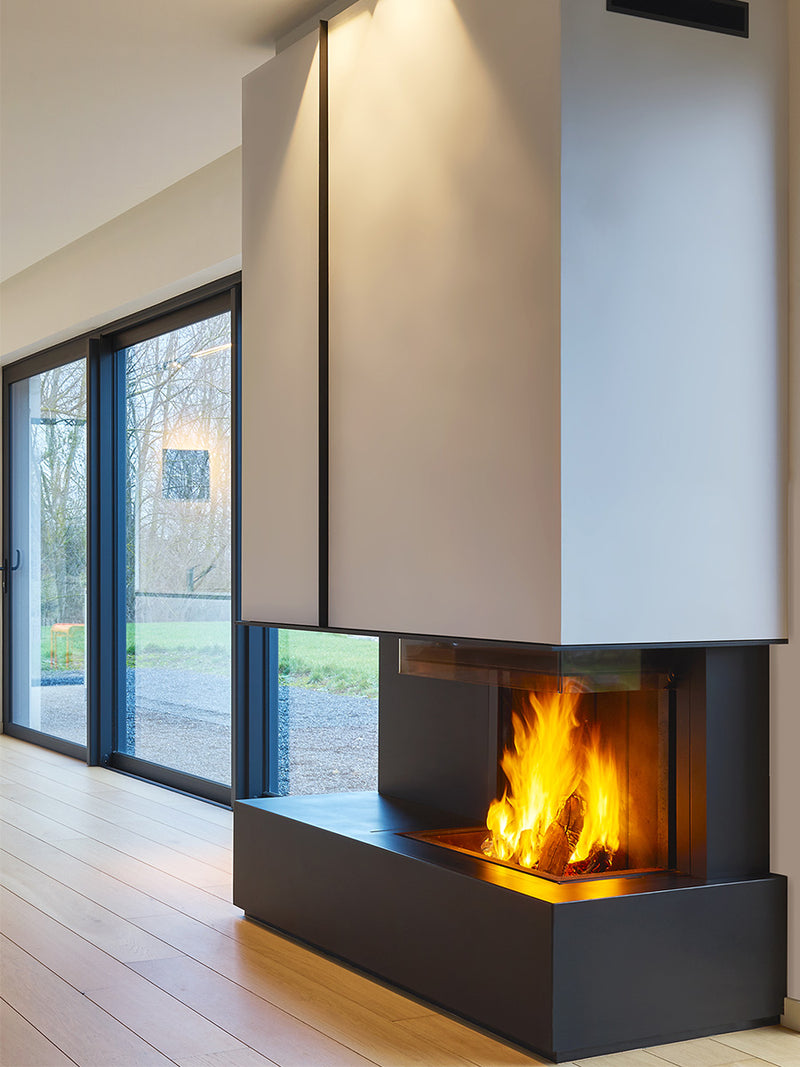 Three-sided Kalfire W90/47S log burner fireplace with curved glass, showcasing flames and sleek design in a modern setting.