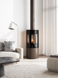 Elegant freestanding RAIS Caro 110 gas fireplace with glass door and side panels showcasing vibrant flames.