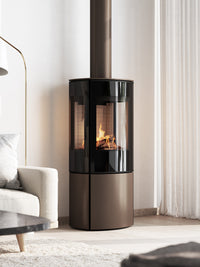 Side view of the RAIS Caro 110 gas fire with a glass door, showcasing flames and elegant design.