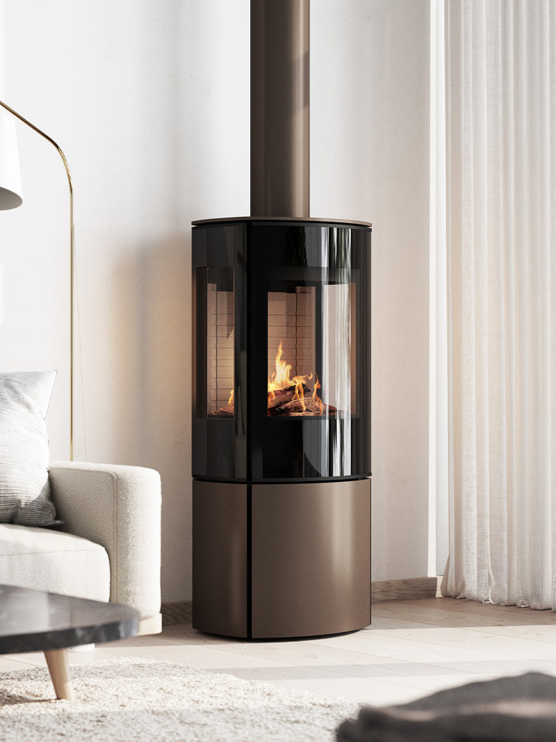 Side view of the RAIS Caro 110 gas fire with a glass door, showcasing flames and elegant design.