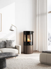 Side view of the RAIS Caro 110 bioethanol fireplace with a glass door, showcasing its rounded design and sleek finish.