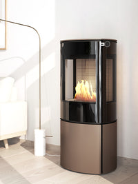 Side view of the RAIS Caro 110 bioethanol fireplace with a glass door, showcasing its rounded design and sleek finish.