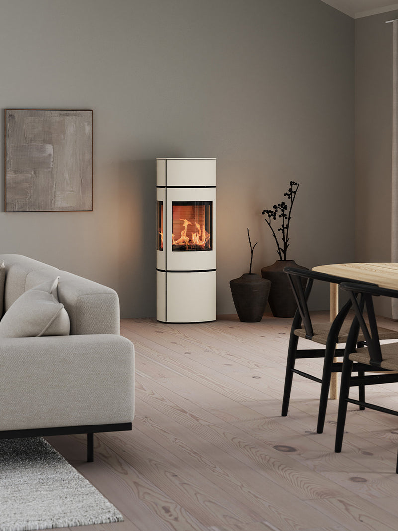 Side view of the RAIS Caro 130 wood burning stove with glass door, showcasing its elegant design and swivel base.