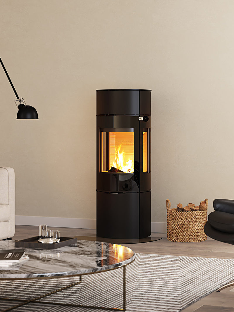 Side view of the RAIS Caro 130 wood burning stove with a glass door, showcasing its elegant design and swivel base.