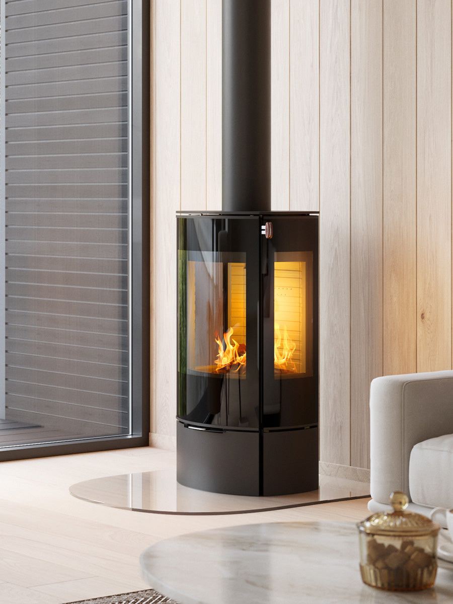 RAIS Caro 90 wood burning stove with a glass door, showcasing a sleek design and large fire chamber in a modern setting.