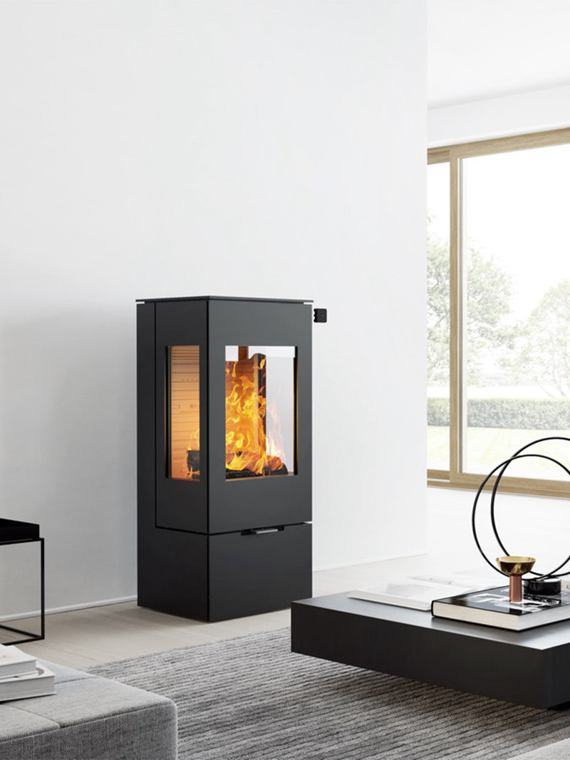 Elegant RAIS Nexo 100 gas fireplace with steel door, large glass panes, and sleek design, front view.