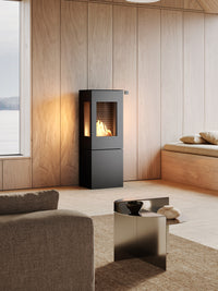 Side view of the RAIS Nexo 120 bioethanol fireplace with glass door, showcasing its cubic design and sharp lines.