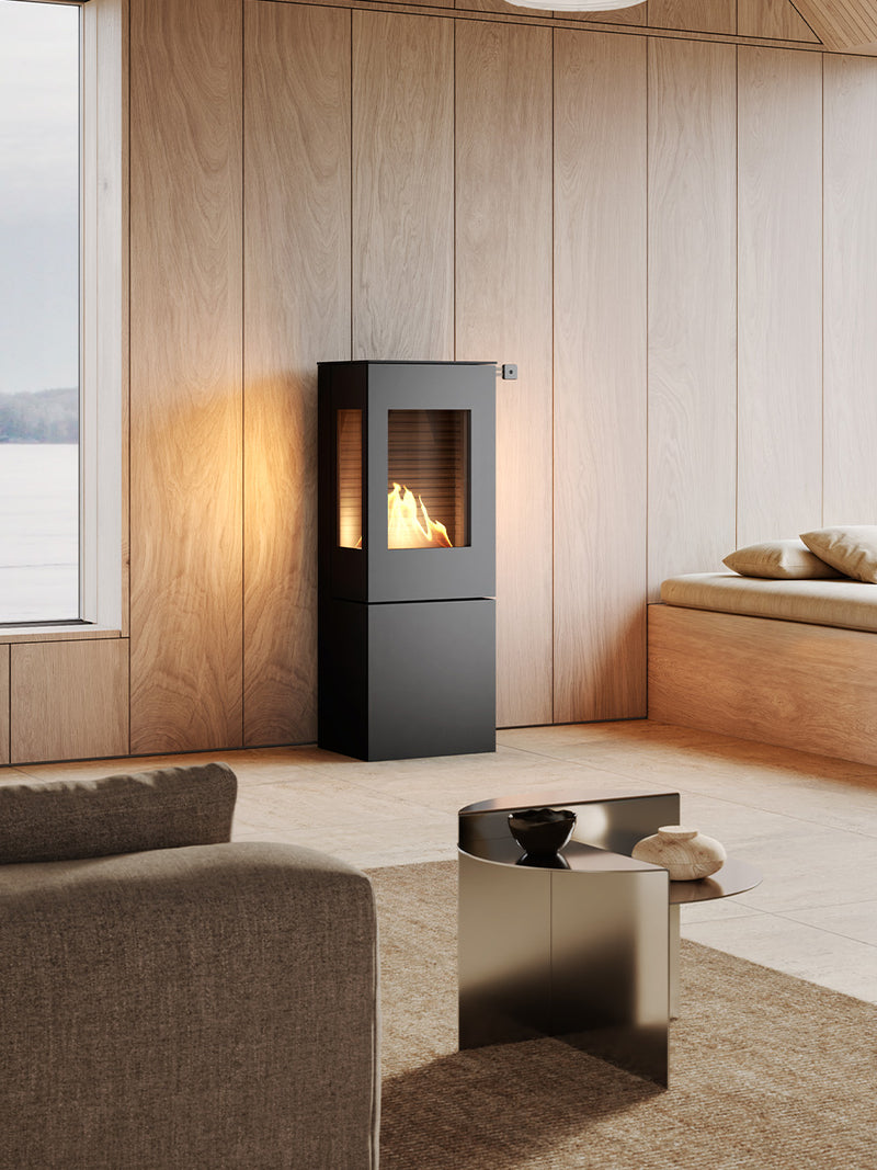 Side view of the RAIS Nexo 120 bioethanol fireplace with glass door, showcasing its cubic design and sharp lines.