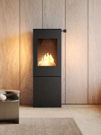 Compact RAIS Nexo 120 bioethanol fireplace with glass door, featuring a sleek cubic design and sharp lines.