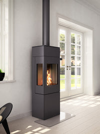 Elegant RAIS Nexo 140 wood burning stove with glass door, showcasing smooth surfaces and geometric design, side view.