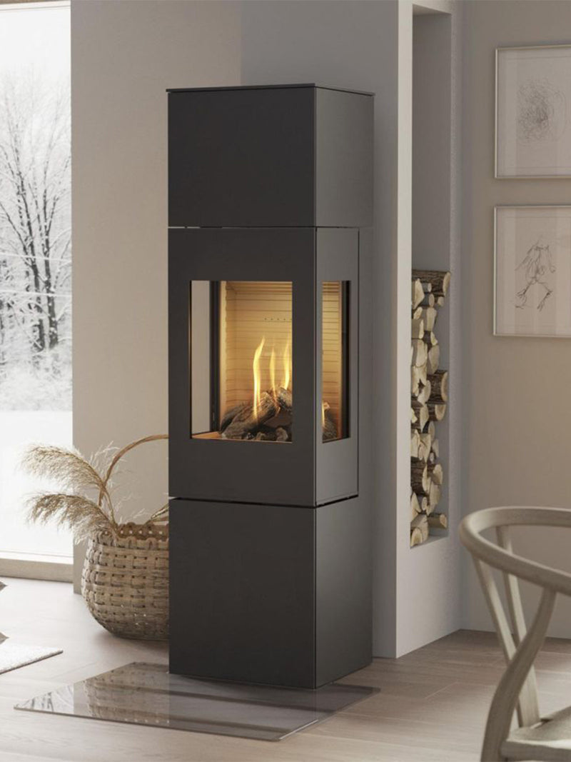 Elegant RAIS Nexo 160 gas fireplace with glass door, showcasing clean lines and large glass panes in a modern setting.