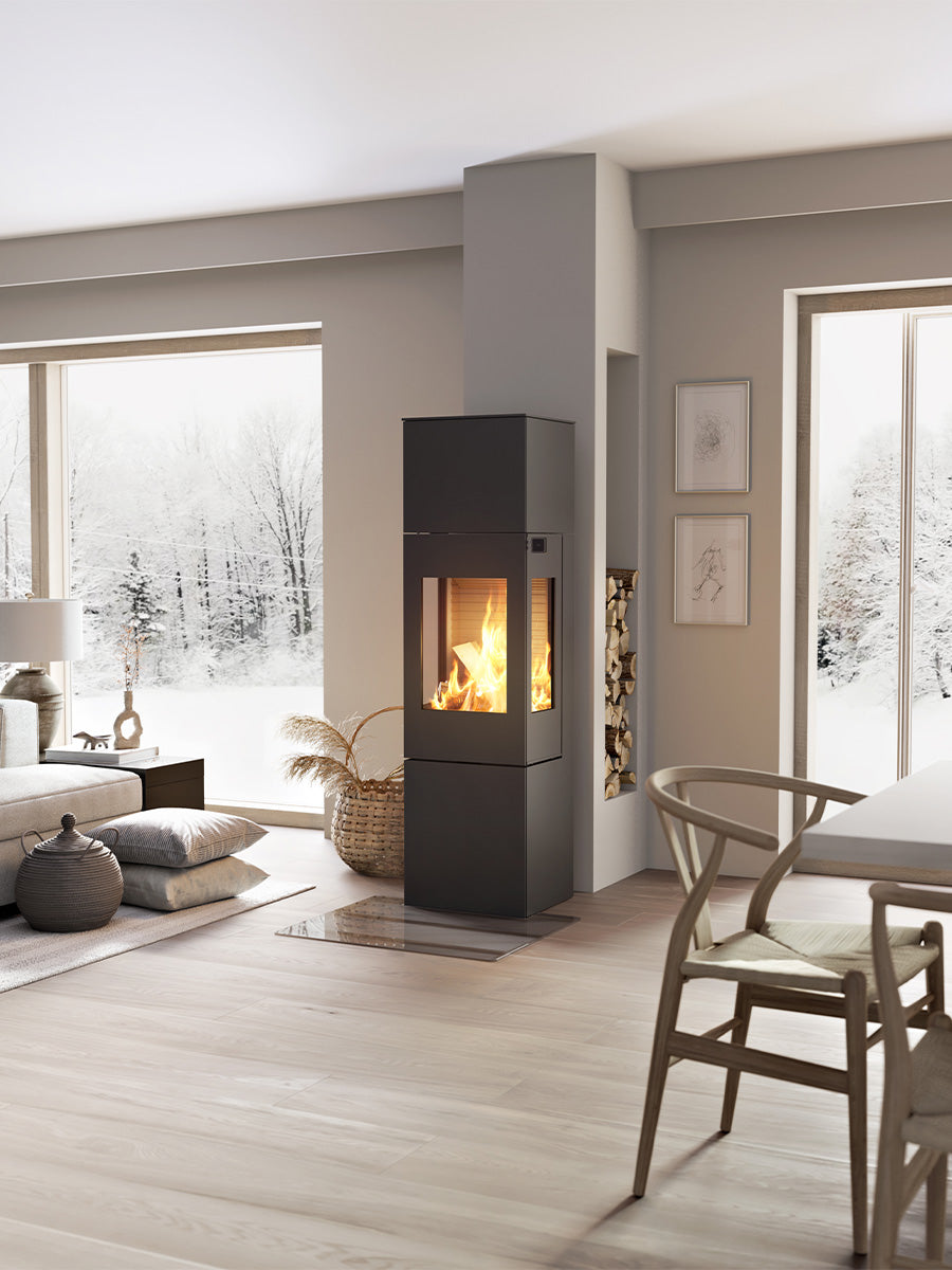 Elegant RAIS Nexo 160 wood burning stove with glass door, showcasing smooth surfaces and large glass panes.