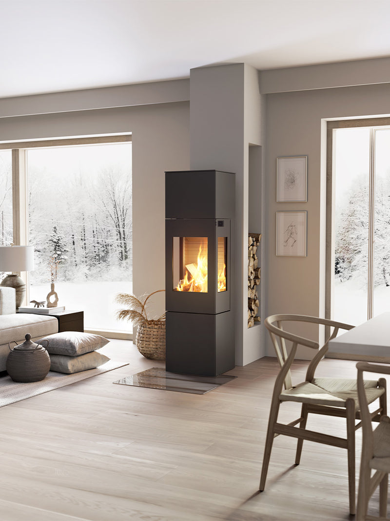 Elegant RAIS Nexo 160 wood burning stove with glass door, showcasing smooth surfaces and large glass panes.