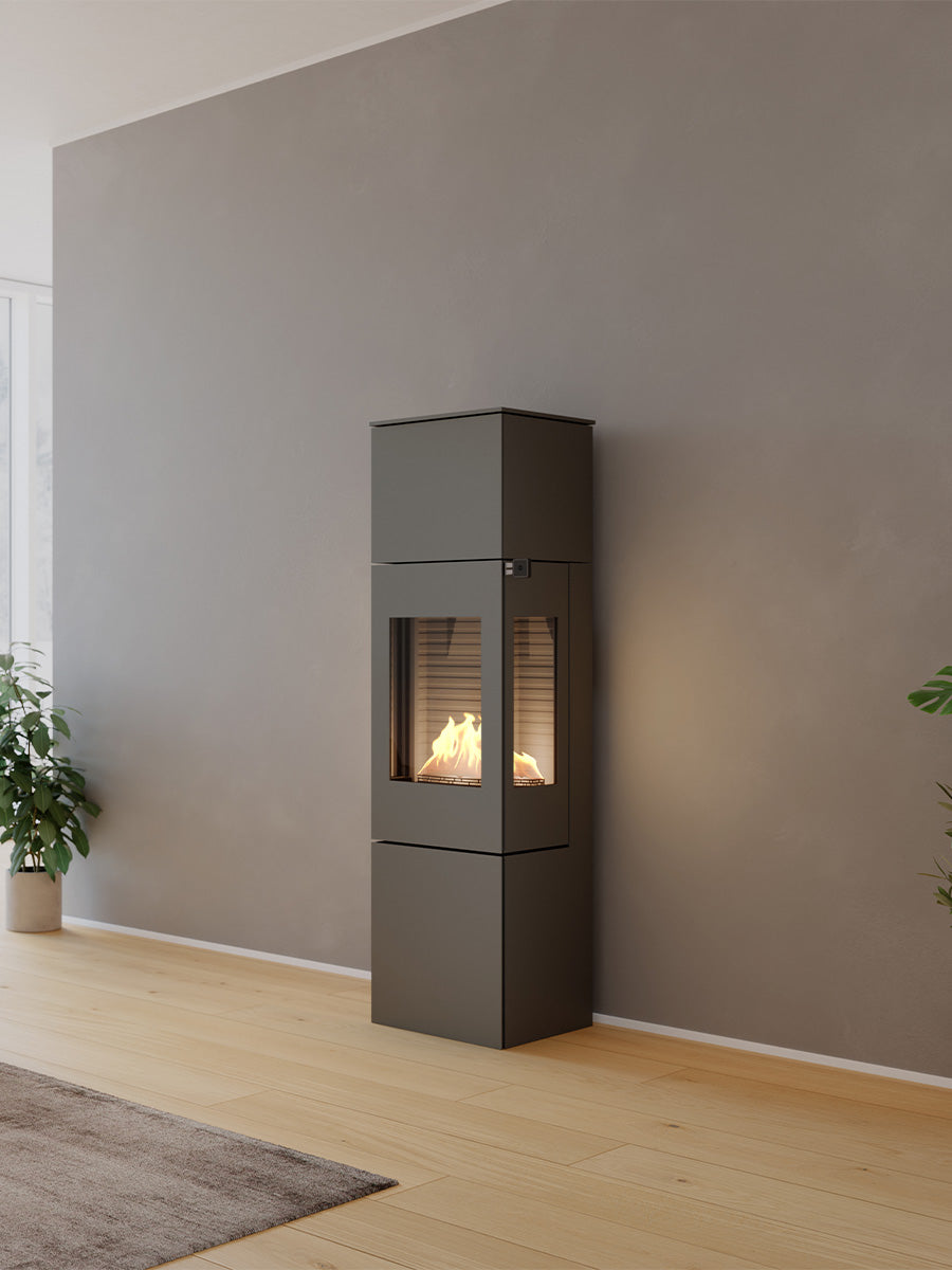 Compact RAIS Nexo 160 bioethanol fireplace with glass door, showcasing its cubic design and sharp lines in a modern setting.