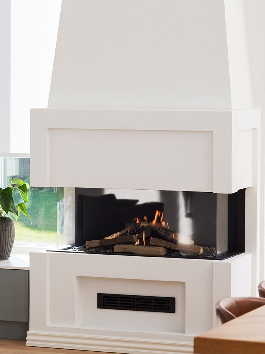 Three-sided glass RAIS Visio 100 3S gas fireplace insert with black frame, showcasing flames and remote control feature.