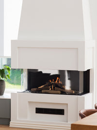 Three-sided glass RAIS Visio 100 3S gas fireplace insert with black frame, showcasing flames and remote control feature.