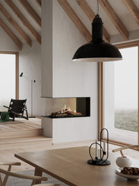 Side view of RAIS Visio 100 RD gas fireplace insert with three glass sides, showcasing flames and modern design.