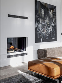 Side view of RAIS Visio 100 T gas fireplace insert tunnel in black frame, showcasing flames visible from both sides.