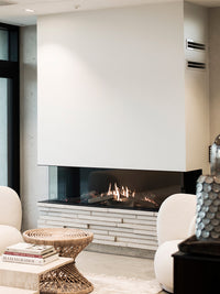 Three-sided view of RAIS Visio 160 gas fireplace insert with flames visible through clear glass and sleek black steel frame.