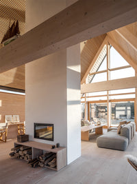 Side view of RAIS Visio 2:1 inset wood burning stove tunnel with sleek black finish and wide glass windows.