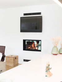 Side view of RAIS Visio 2:1 inset wood burning stove tunnel showcasing sleek design and double-sided glass windows.