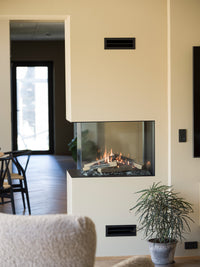 RAIS Visio 70 RD gas fireplace insert room divider with two glass fronts, showcasing a sleek black design.