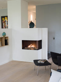 Side view of RAIS Visio 70 C Gas Fireplace Insert in black frame, showcasing flames and corner placement.