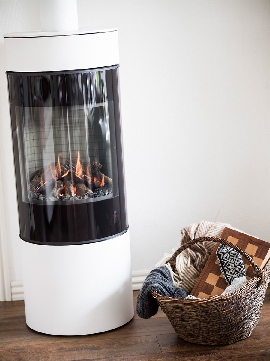 Side view of the RAIS Viva L 120 gas fire stove, showcasing its sleek design and large glass door.