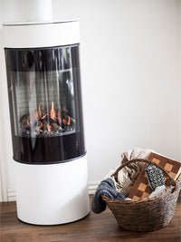 Side view of the RAIS Viva L 120 gas fire stove, showcasing its sleek design and large glass door.